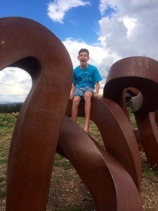 This post has been brought to you by the boy with the wide open mouth on the Wide Brown Land sculpture.